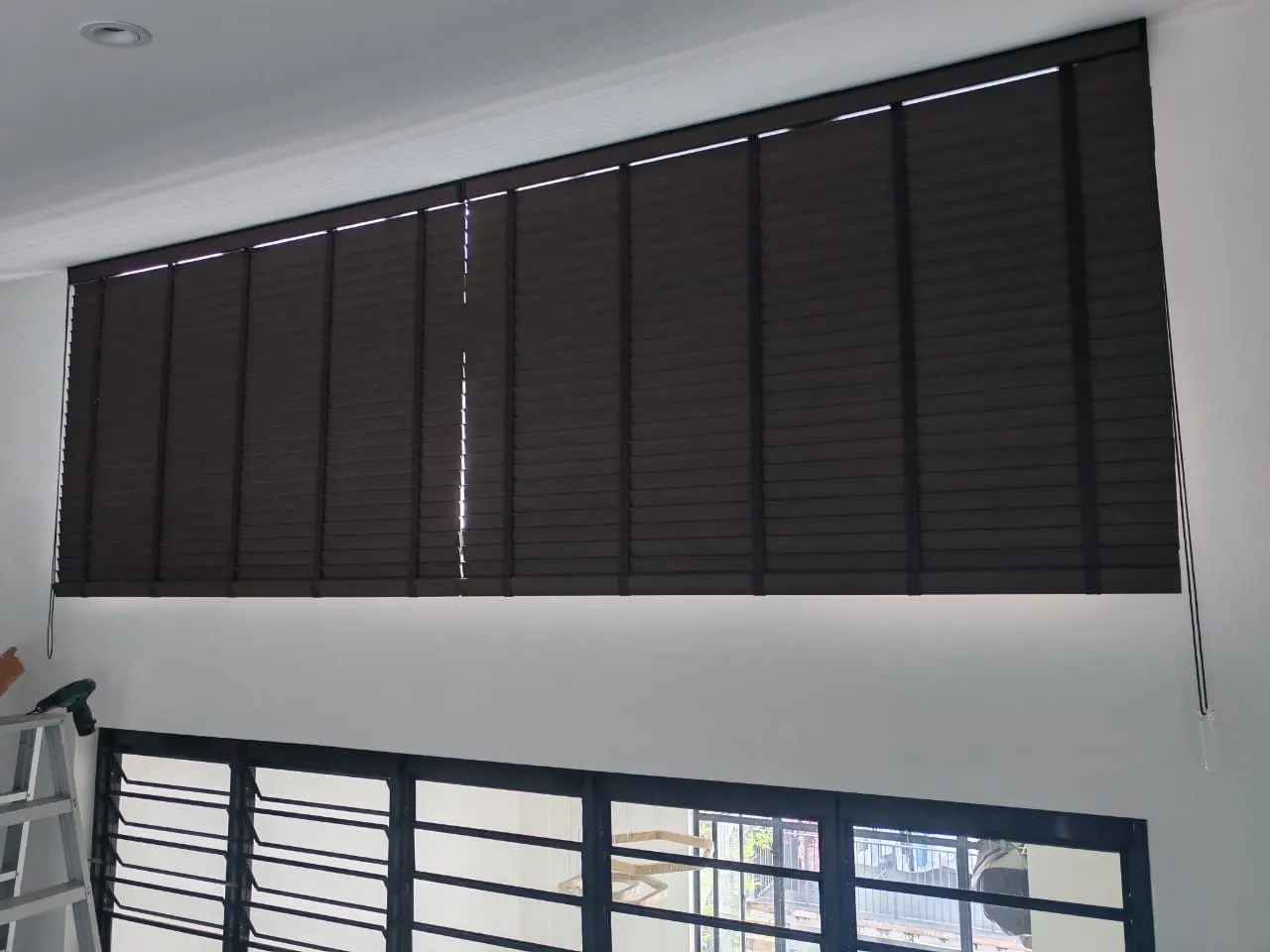 brown curve venetian blinds sloped window 1