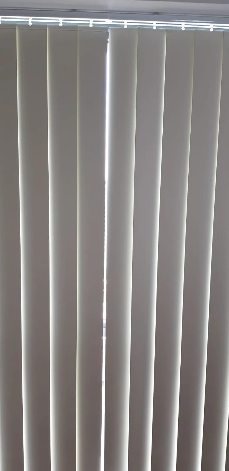 cream vertical blinds slats closeup